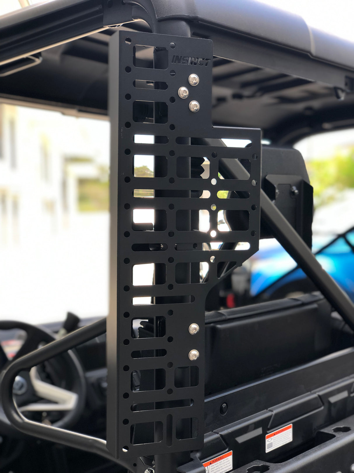 Close up showing InSinct CFMoto UForce 1000 side molle panel fitted