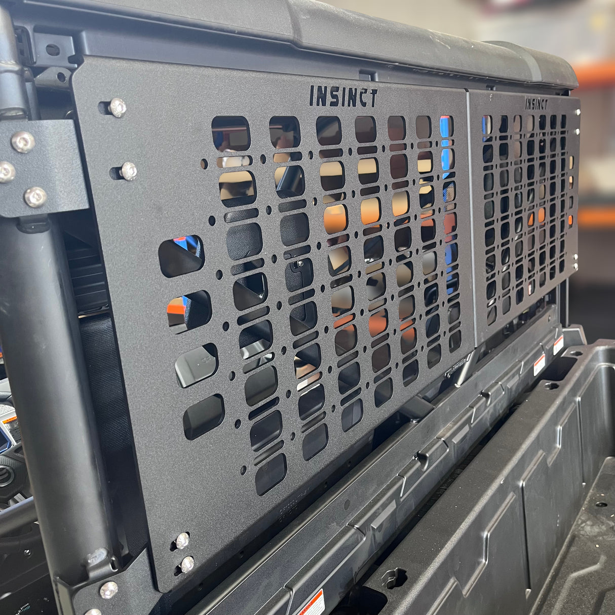 Storage solutions for CFMoto UForce 1000, side profile of rear molle panel by InSinct