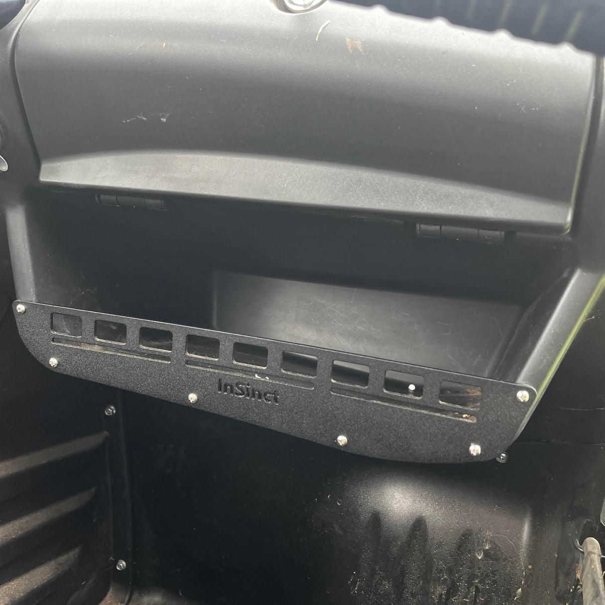 Close up of InSinct CFMoto UForce 800 storage panel