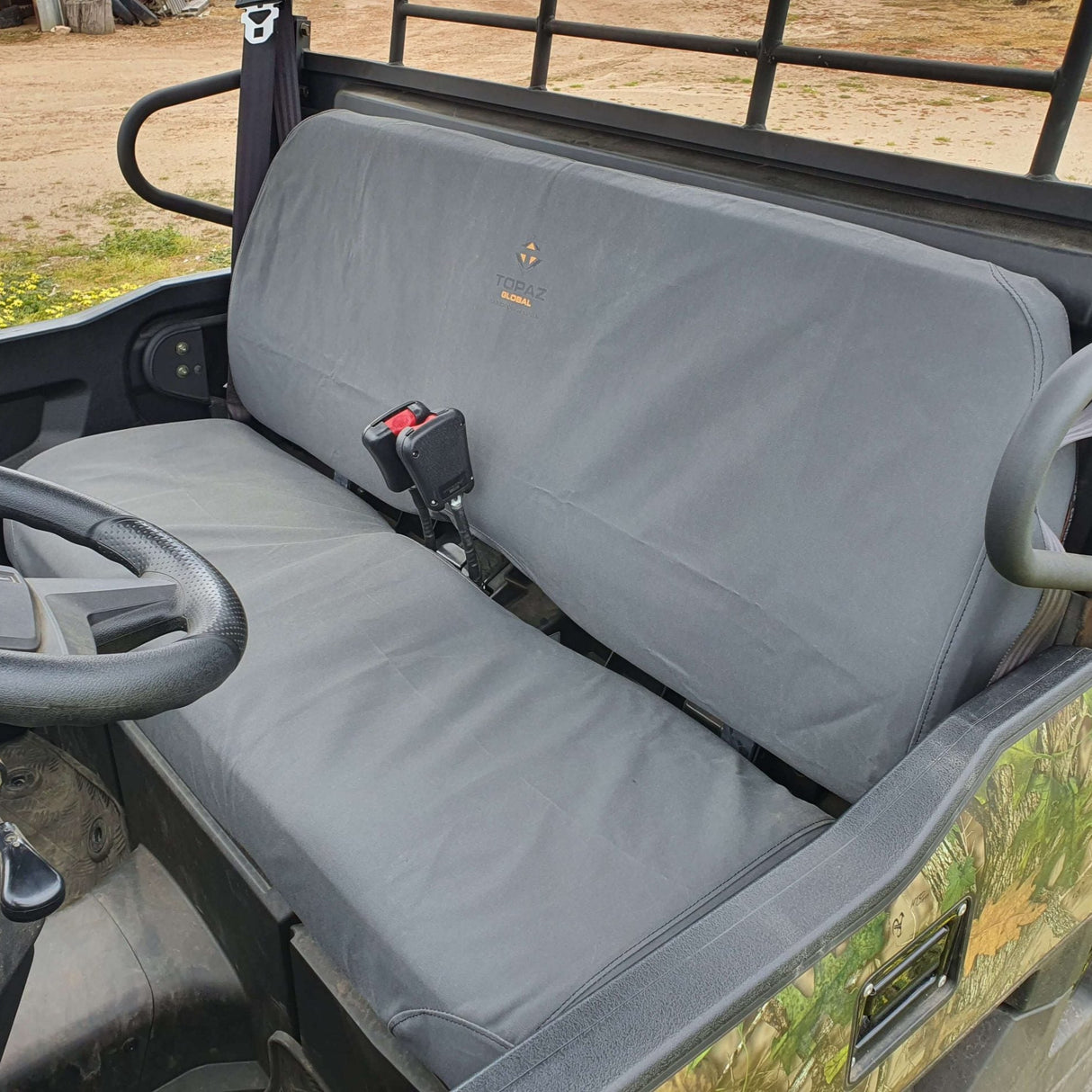 Custom-fit canvas seat cover for Kawasaki Mule PRO MX 700, providing protection from dirt, mud, and UV rays in rugged outdoor conditions.