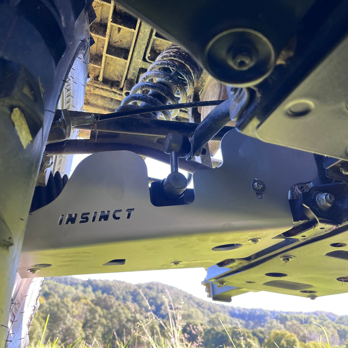 Close-up of rear CV protection plate with detailed alloy finish