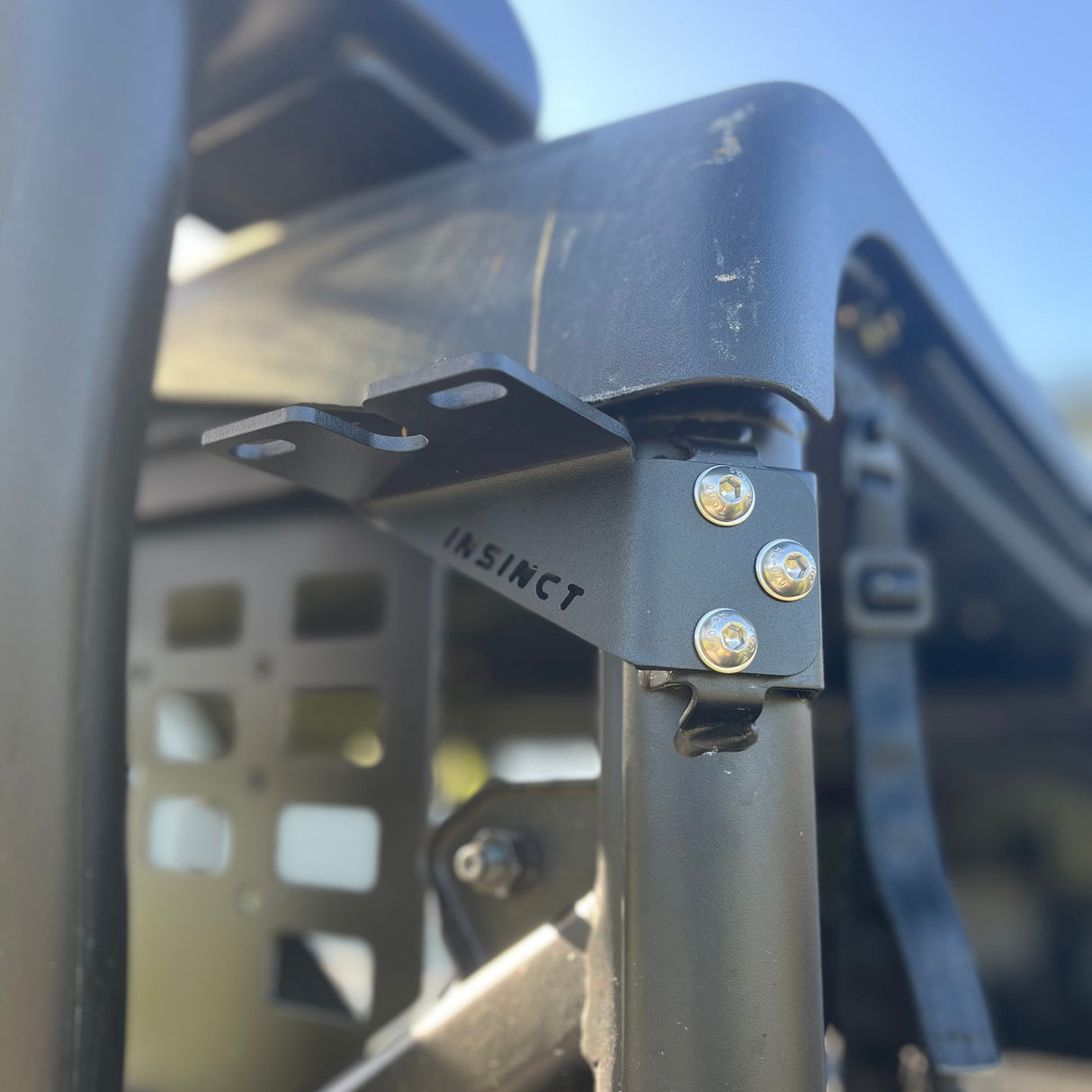 Close-up of InSinct powder-coated stainless steel rear worklight & aerial bracket