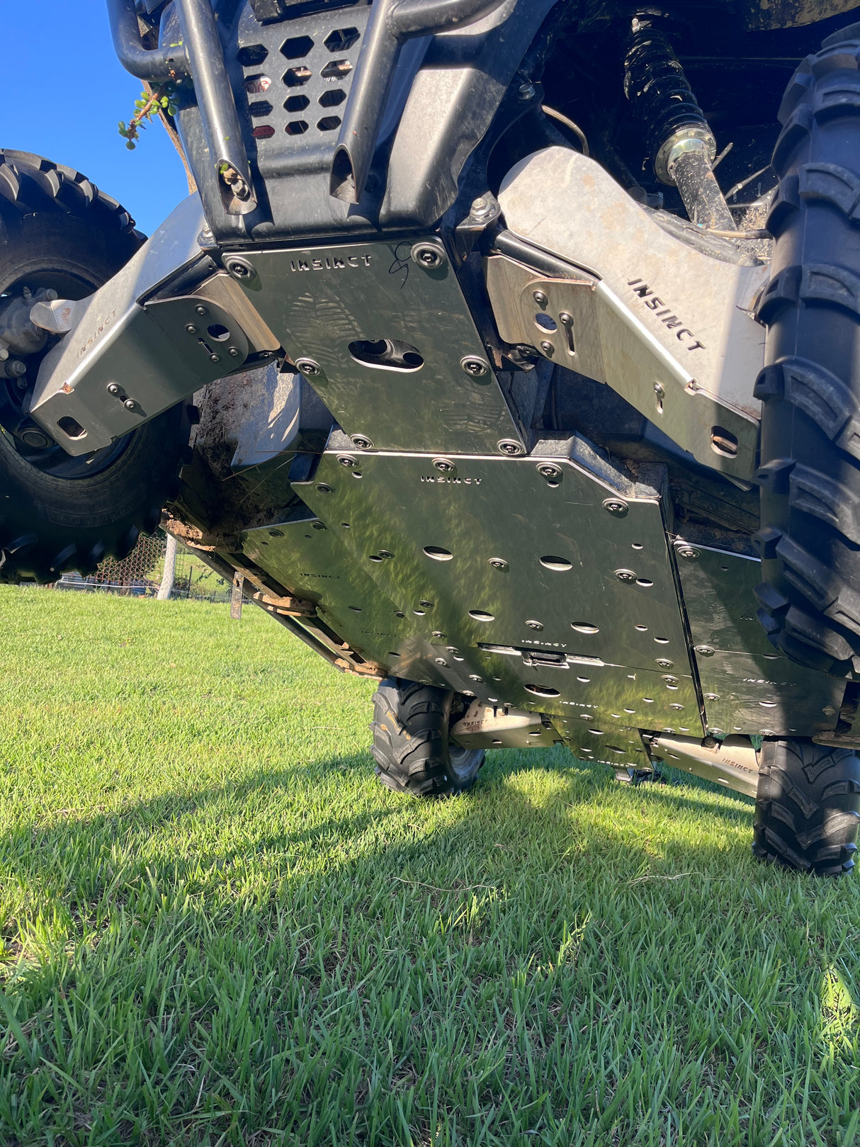 Close-up detail showing the 5mm aluminium construction and mounting points of the InSinct skid plate for the UForce 600.