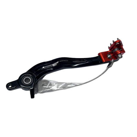 Close-up top view of KTM motorcycle with upgraded larger brake pedal installed