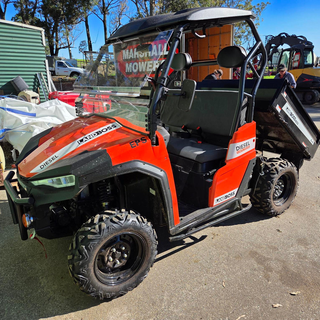 Close-up of LANDBOSS 800D & 1100D seat showing fitment of Topaz Global Charcoal canvas seat cover on the UTV.