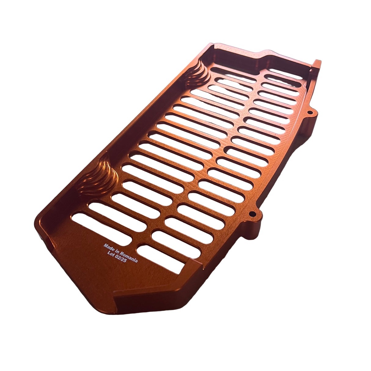 Top-down angle of an orange unibody aluminum radiator guard, illustrating full radiator coverage and symmetrical airflow pattern