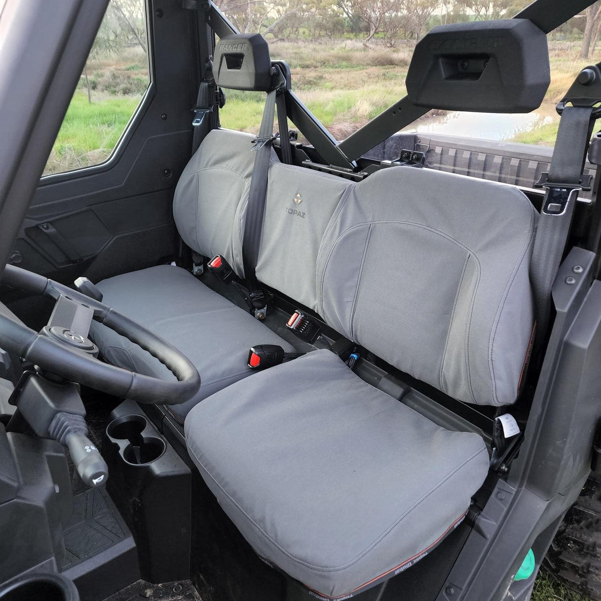 Charcoal canvas seat cover installed on Polaris Ranger 1000 Diesel 2022 model with bolstered seats – precision fit and durable canvas