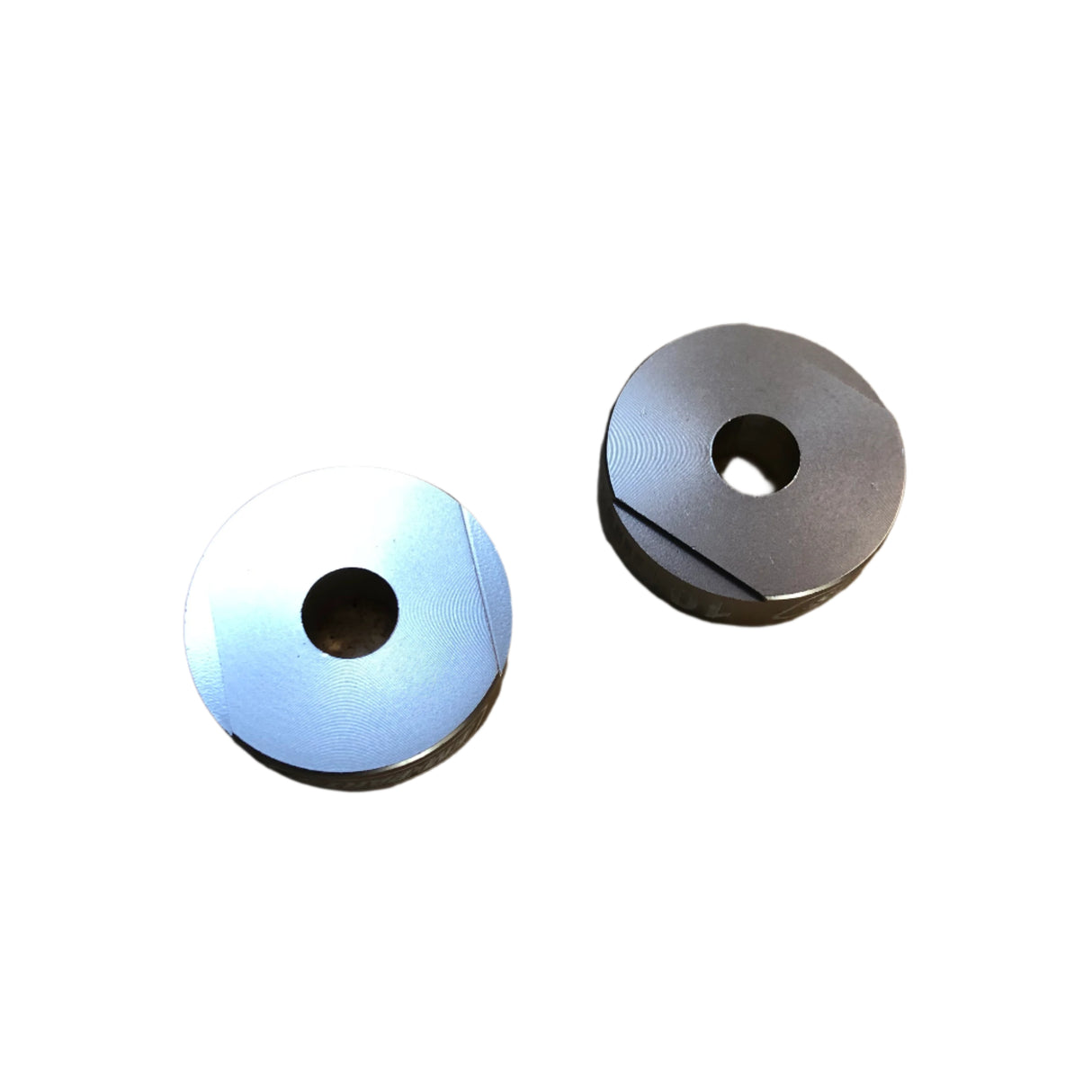 Pair of handlebar risers positioned to show profile and spacing