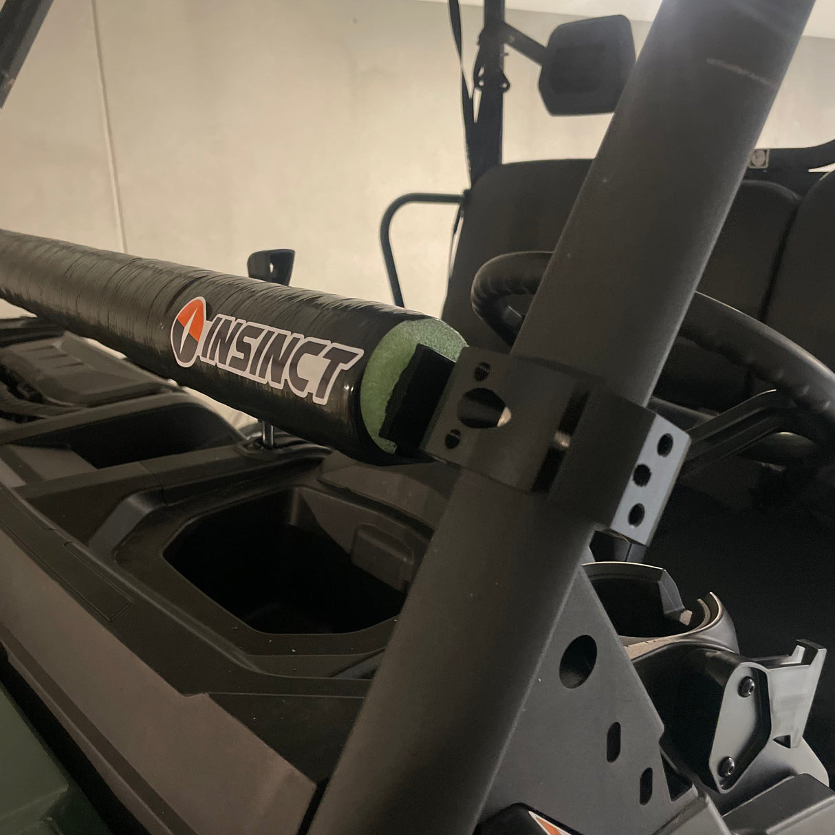 Heavy-duty roll clamp in use on a Can-Am Defender, securely holding a shooting platform for improved stability during hunting and target shooting.