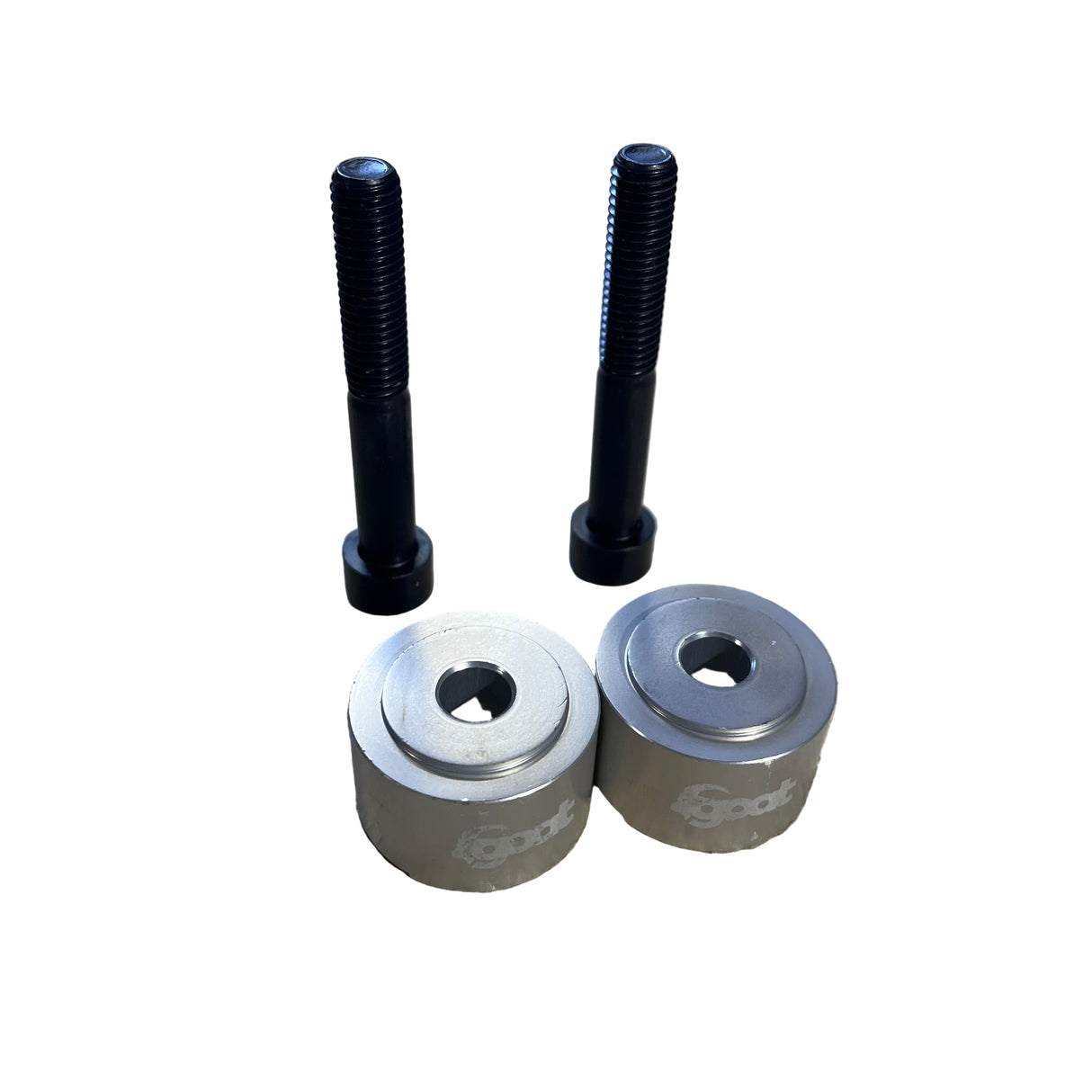 Top-down close-up of a single 20 mm riser showing the shape of the mounting holes and anodized aluminum surface