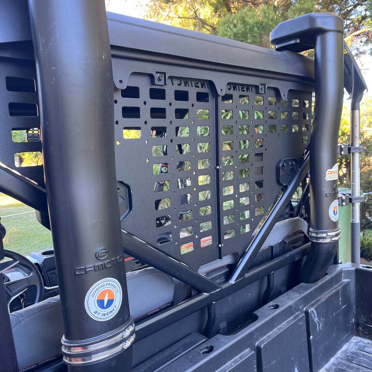 Side angle of CFMoto UForce 600 with gun holder panel installed behind seats