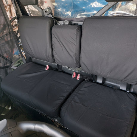 CFMoto UForce 1000 front row Armadillo canvas seat covers installed, heavy-duty seat protection for farming, hunting and recreational use.