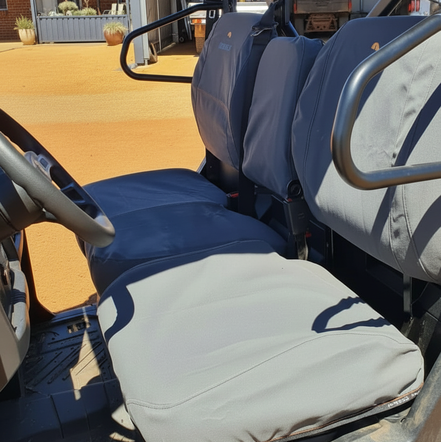 Close-up of a CFMoto U10 Pro with seat covers on a farm setting.