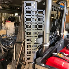 Driver's side Molle panel installed on a CFMoto UForce 600 UTV, showing the panel's grid system and mounting points.