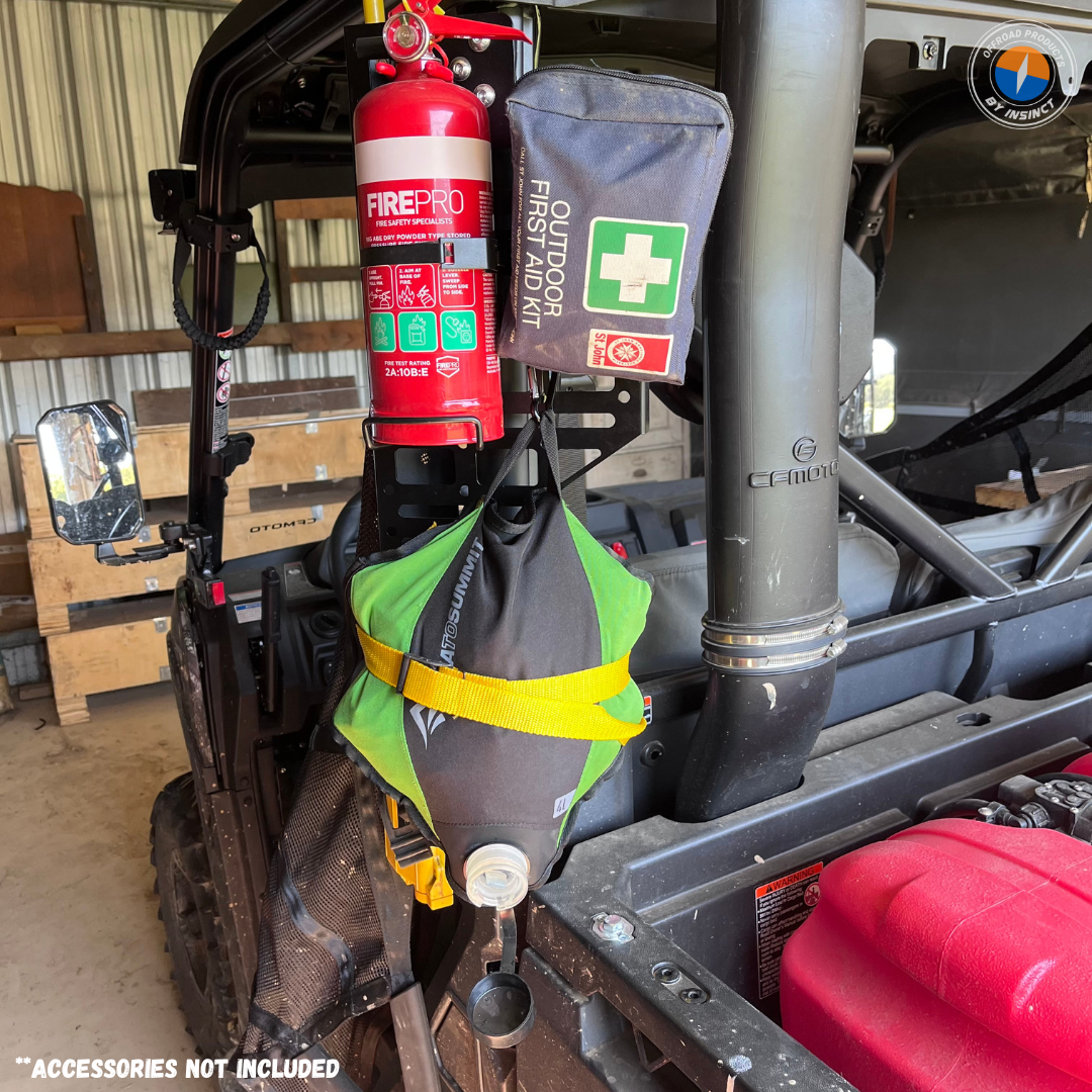 Mounting points of the MOLLE panel attached to the roll frame of a CFMoto UForce 600 using a clamp bracket.
