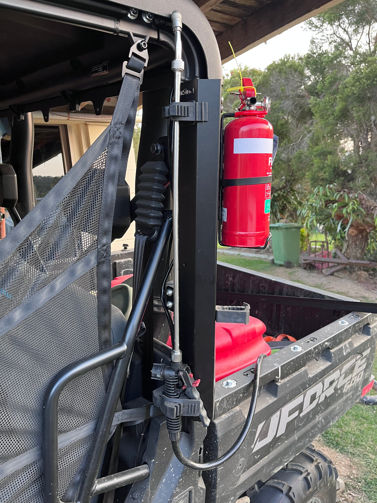 Off-road storage solution using a MOLLE panel on the drivers side of a CFMoto UForce 600. Ideal for weed spraying setups