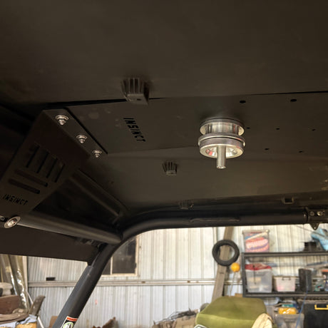 InSinct spotlight roof mount reinforcement plate fitted to a CFMoto UForce 600 roof for mounting spotlights and accessories.