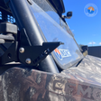 CFMoto UForce 600 A-pillar worklight and aerial mount installed near side mirror