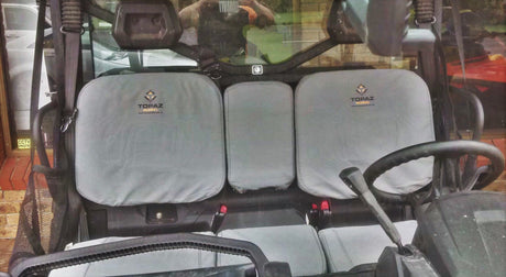 Full set of canvas seat covers installed on Can-Am Defender, showing tailored fit and rugged material built for off-road protection.