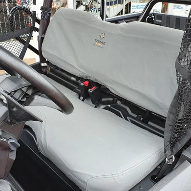 Charcoal canvas seat and backrest cover installed on Honda Pioneer 500 or 520, showing snug fit and rugged material