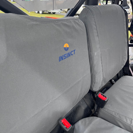 Close-up of tight stitching and tailored fit of canvas seat covers on CFMoto UForce 600