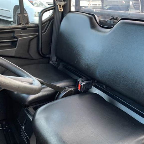 Original two-seater bench of Polaris Ranger 570HD (2016–current) without canvas seat covers, showing the hand‑brake between seats.