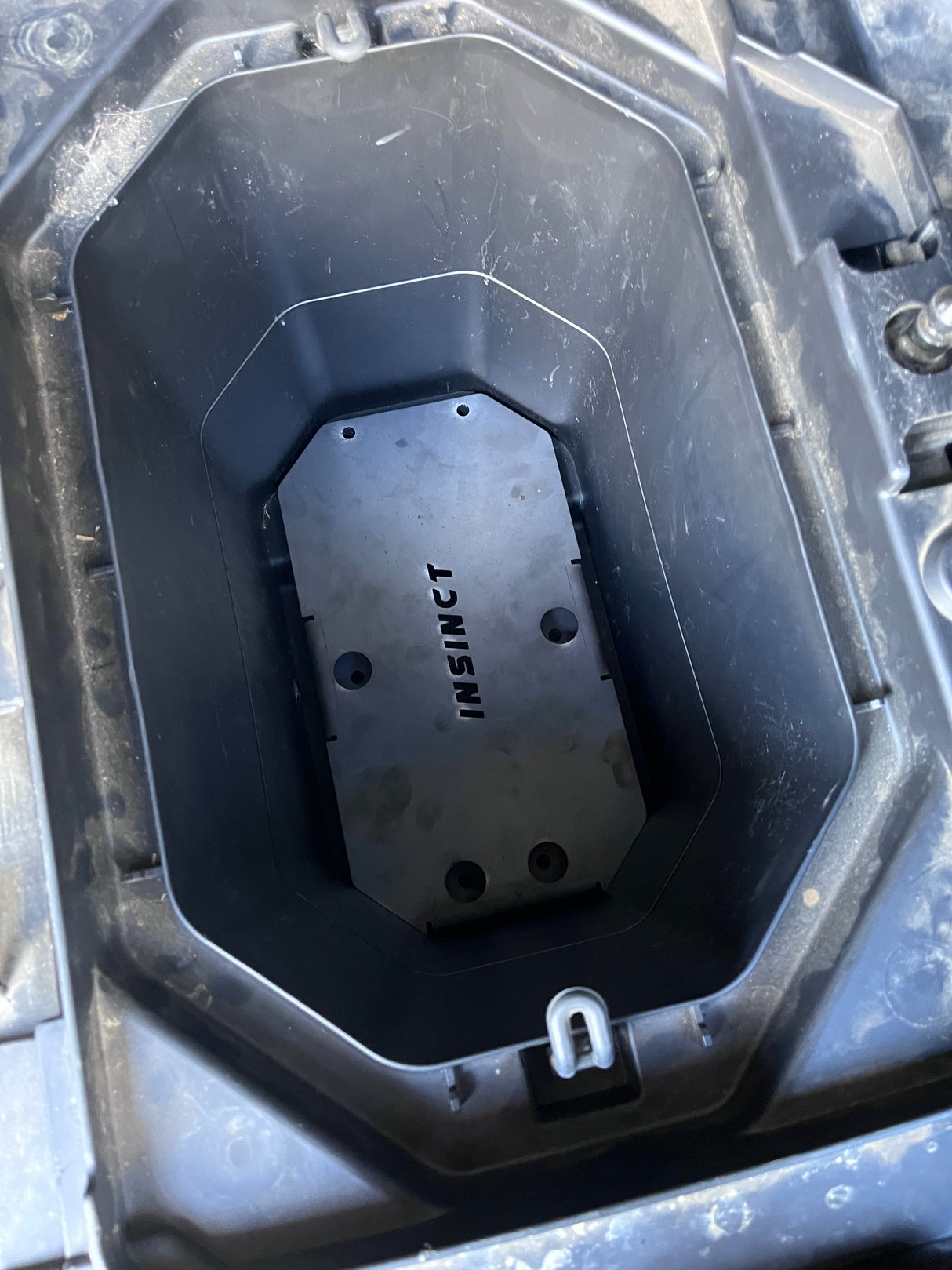 Installed Auxiliary Dual Battery Tray in a CFMoto UForce 600, showing the tray’s precise fit and rust-resistant finish in an off-road environment