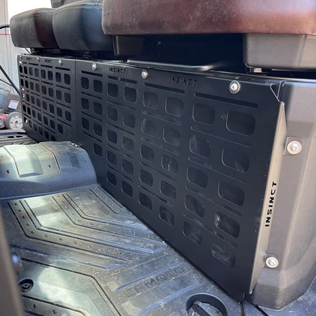 Footwell MOLLE panel installed in a CFMOTO U10 Pro showing accessible mounting area behind foot position.