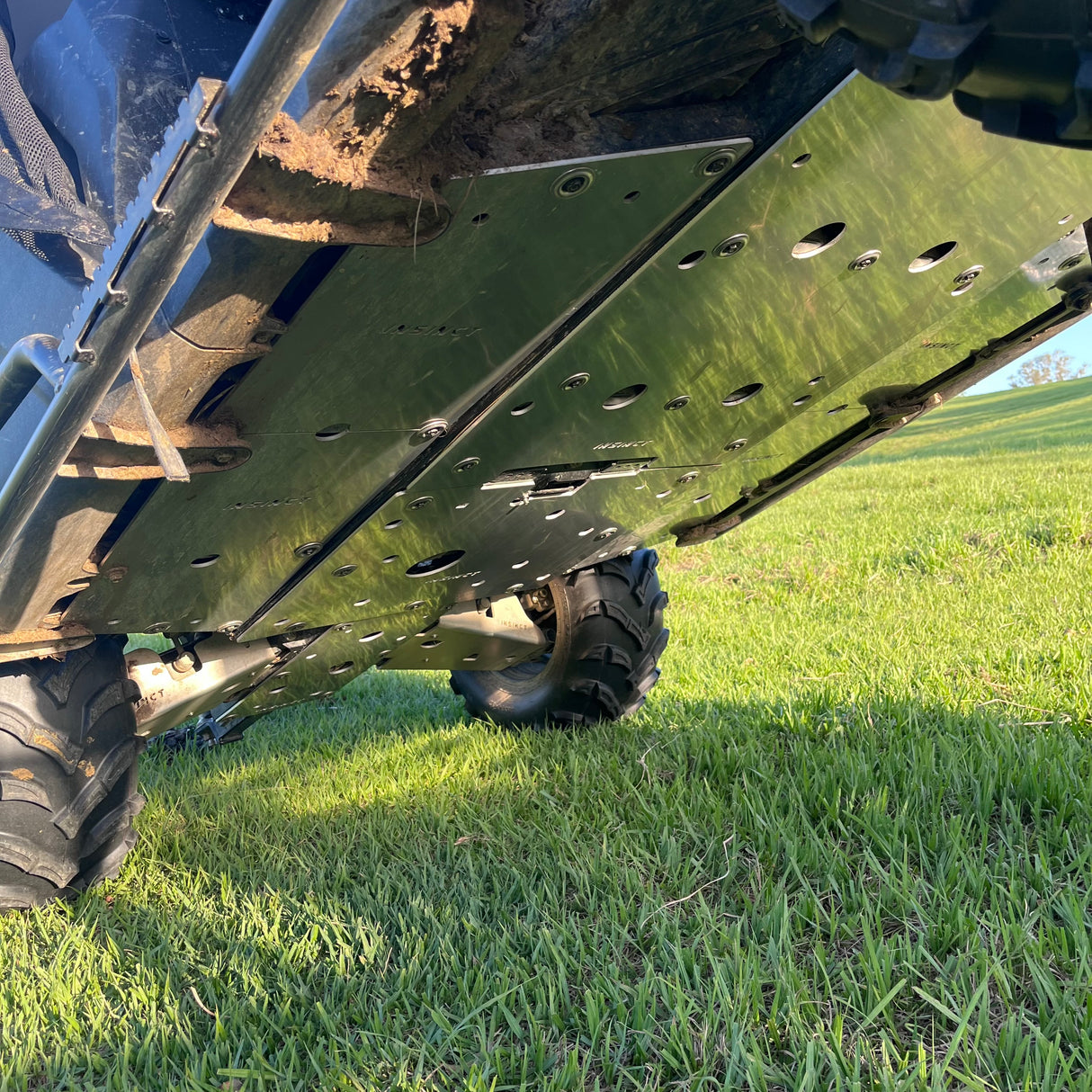 Full underbody view showing complete coverage of the InSinct 5mm aluminium skid plate fitted to a CFMoto UForce 600.