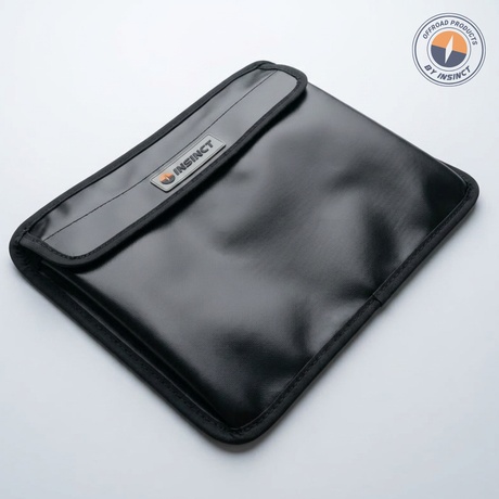 Heavy duty PVC storage pouch attached to InSinct MOLLE panel inside UTV cabin