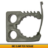 Quick Fist 3 inch clamp securely holding a fire extinguisher on a vehicle or workshop mounting surface.