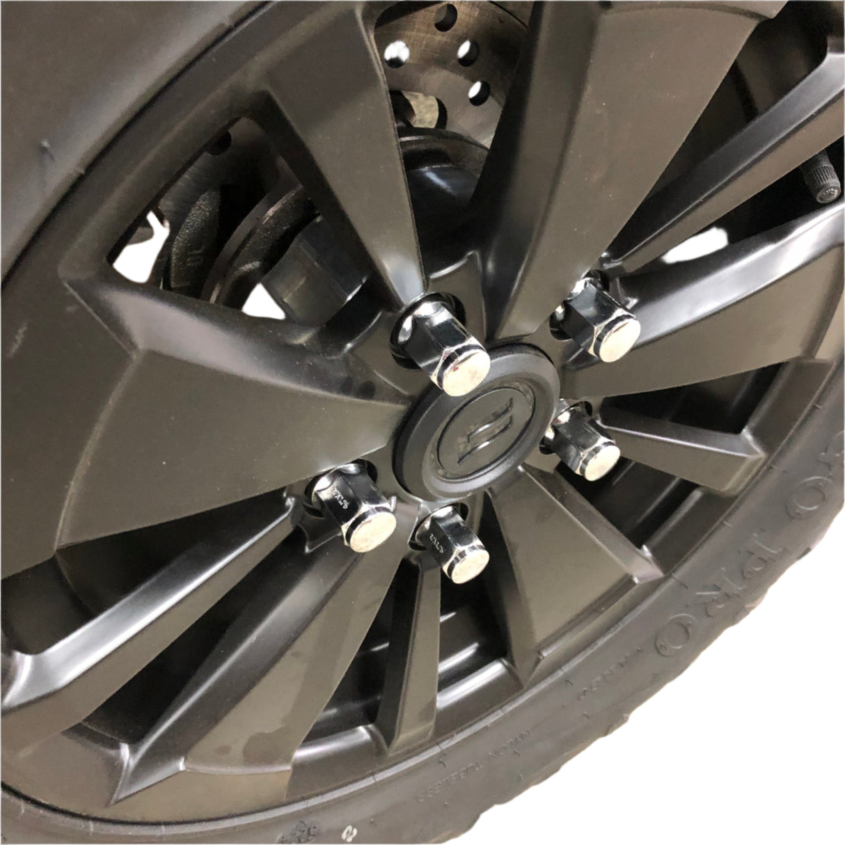 Close-up of wheel spacer with 12mm studs and 19mm hex nuts to highlight build quality and detail.
